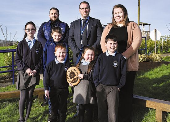 School pupils celebrate after winning eco accolade